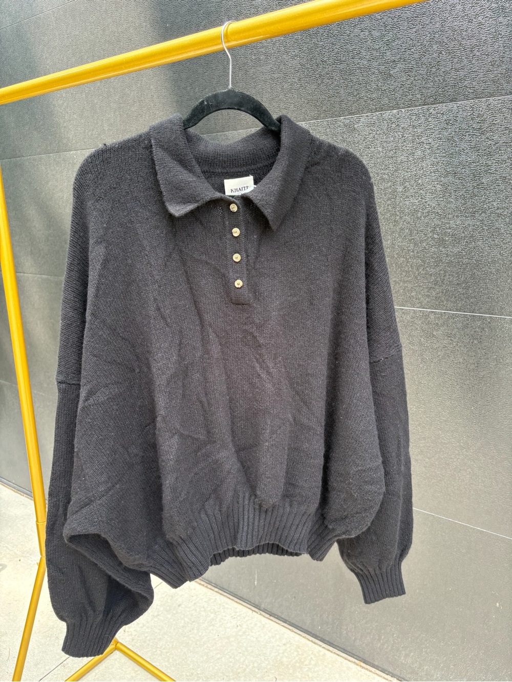 KHAITE Black Polo-Collar Sweater with Gold Buttons
